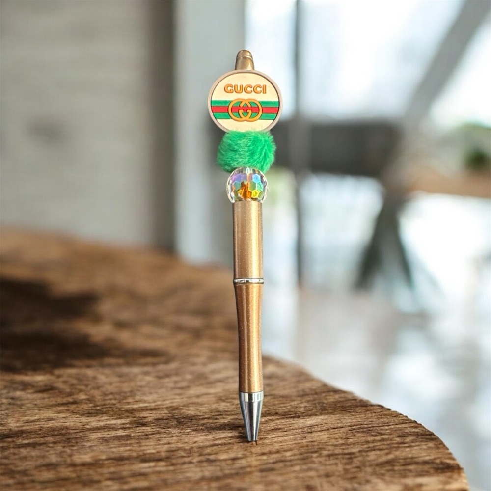 Gold Pen with Green and Multicolor Accents